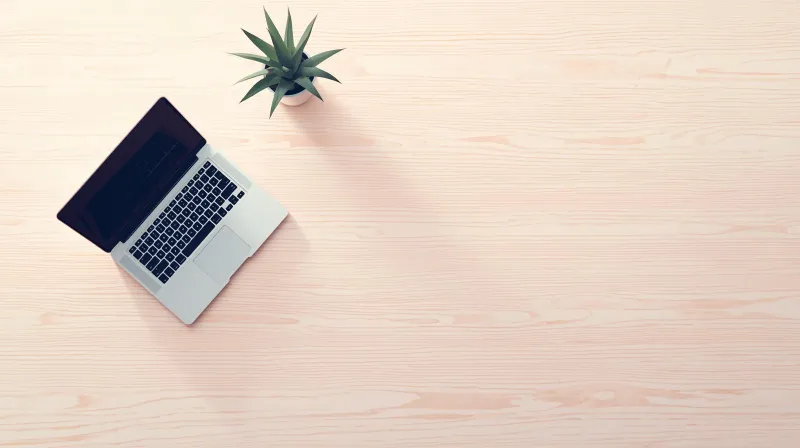 A minimal desk with only essential items representing the type of user who benefits from The SEO Framework plugin.